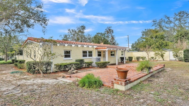 rear view of property featuring a patio area