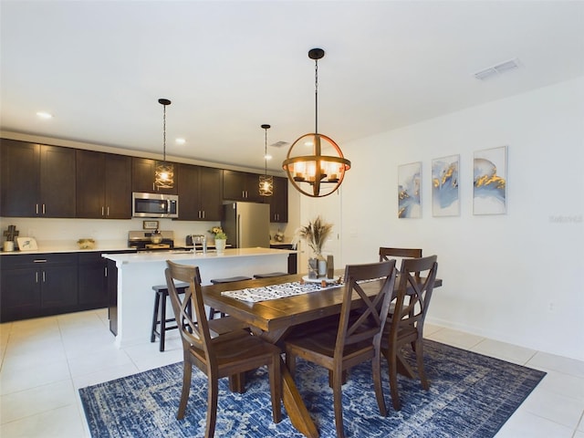 tiled dining area featuring sink