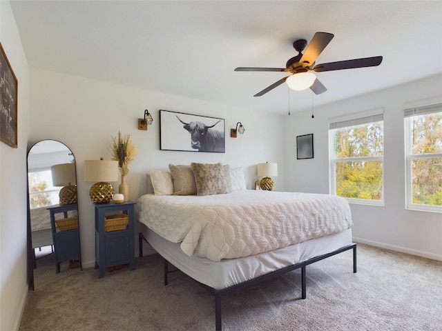 bedroom with ceiling fan and carpet floors