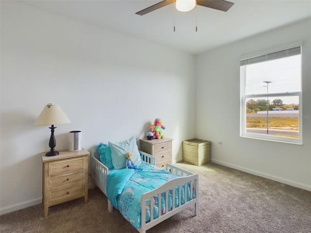 carpeted bedroom featuring ceiling fan