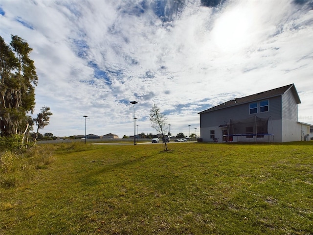 view of yard with a trampoline