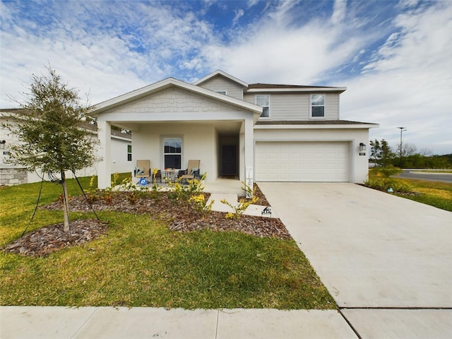 view of front of house featuring a garage, covered porch, and a front yard