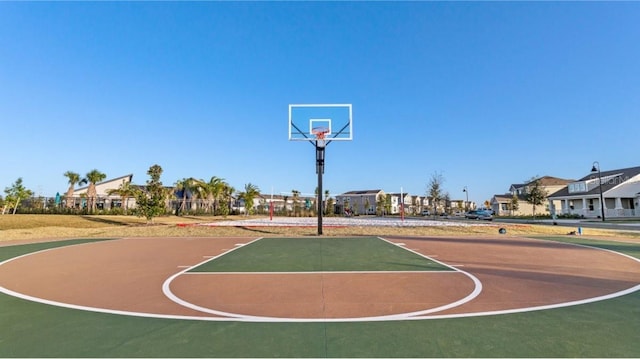 view of basketball court featuring community basketball court and a residential view