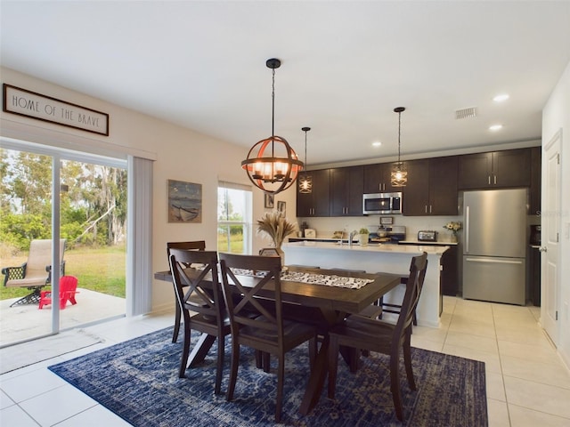 dining space featuring light tile patterned floors, visible vents, and recessed lighting