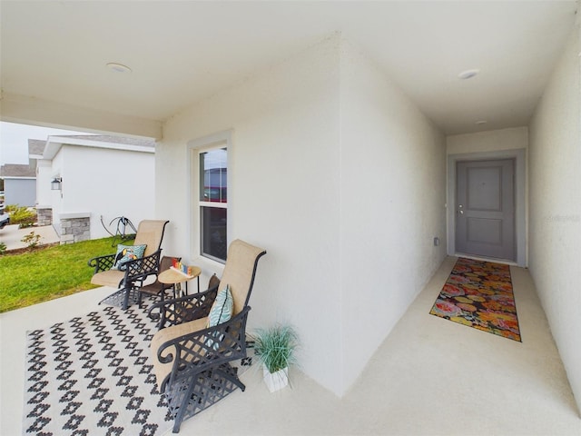 view of exterior entry featuring stucco siding