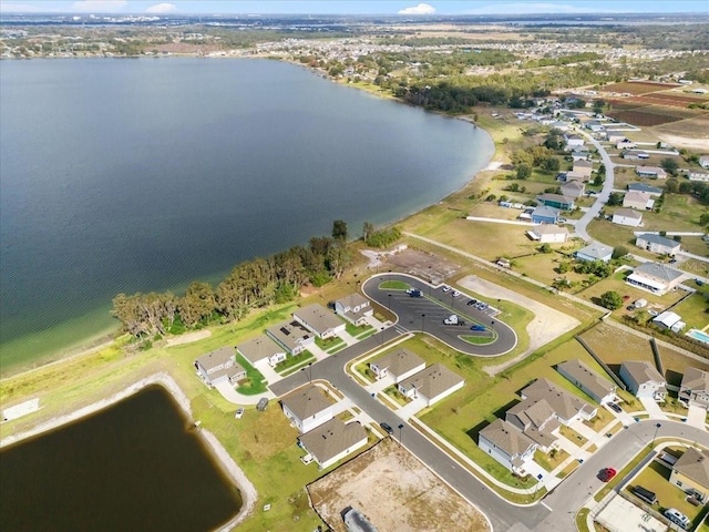 bird's eye view with a residential view and a water view