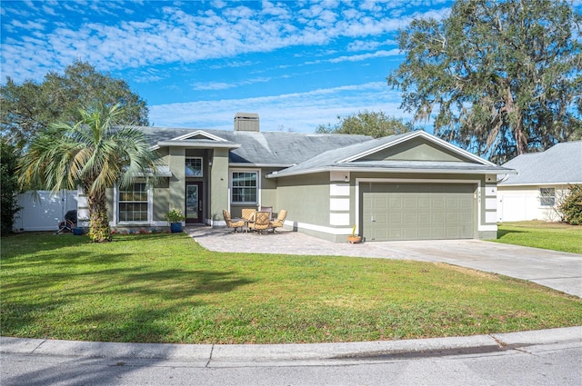 ranch-style home with a garage and a front yard