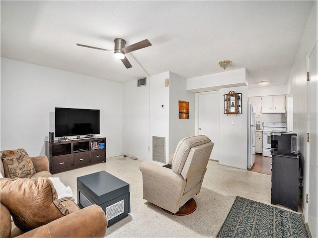 living room featuring ceiling fan