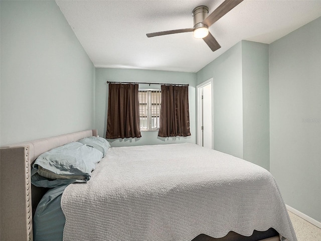 bedroom with ceiling fan and carpet flooring