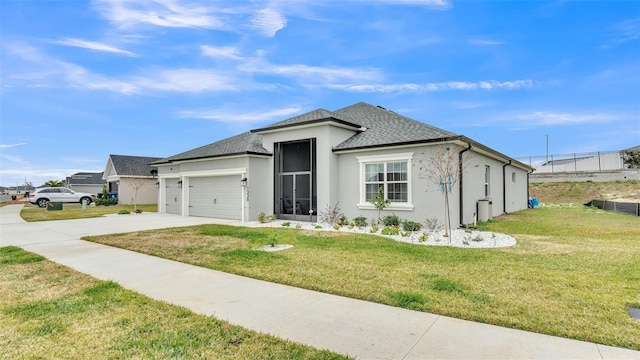 view of front of property featuring a garage and a front yard