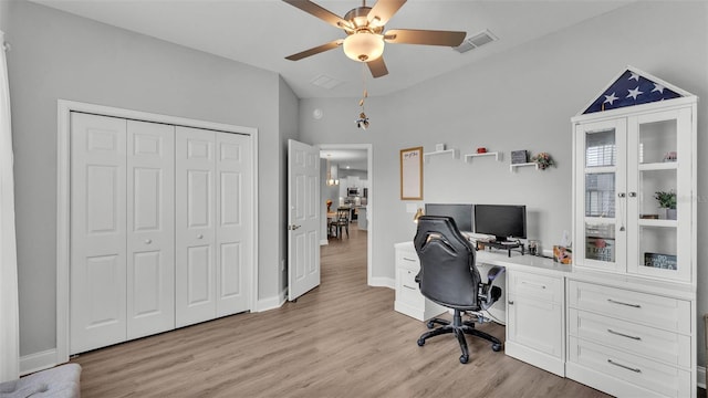 office featuring light hardwood / wood-style floors and ceiling fan