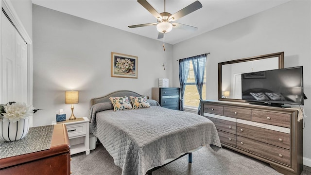 bedroom with ceiling fan and dark carpet