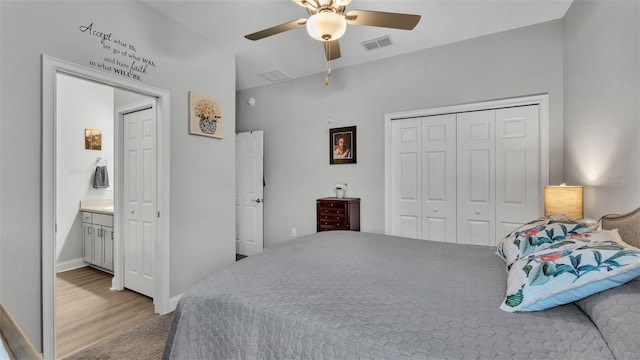 bedroom featuring ceiling fan, hardwood / wood-style floors, and a closet