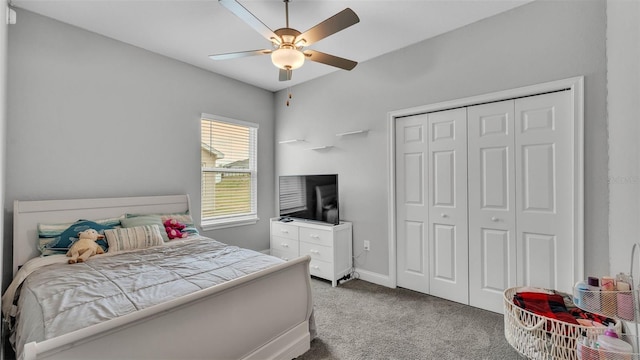 bedroom featuring carpet floors, ceiling fan, and a closet