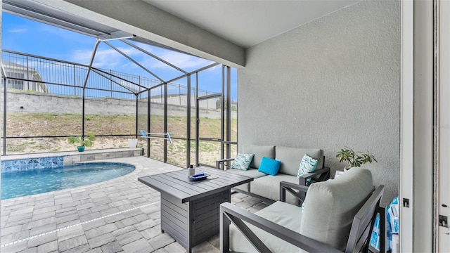 view of patio featuring an outdoor living space and a lanai