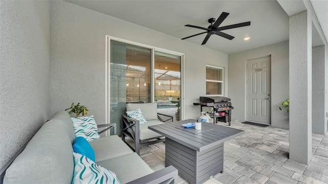 view of patio / terrace featuring an outdoor living space, ceiling fan, and a grill