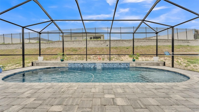 view of pool featuring a lanai and a patio area