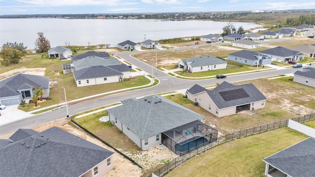 drone / aerial view with a water view