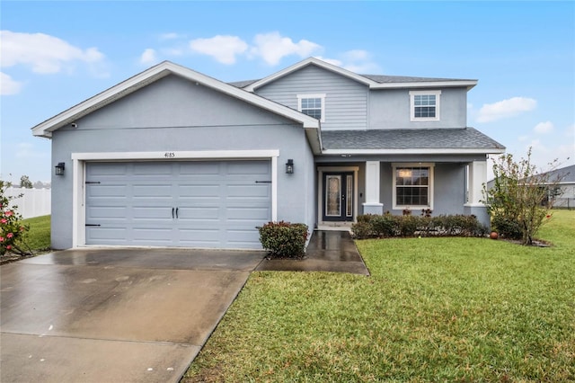 view of front of house with a garage, a porch, and a front yard