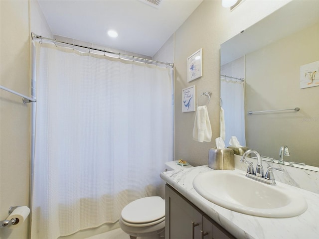 full bathroom with vanity, toilet, and shower / bath combo