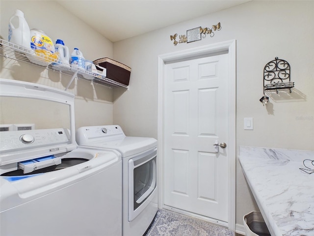 laundry room with washing machine and clothes dryer