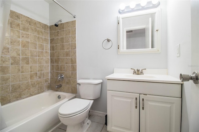 full bathroom with vanity, tile patterned flooring, tiled shower / bath combo, and toilet