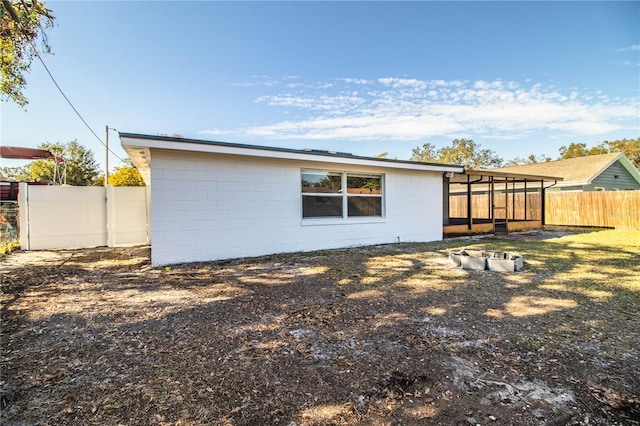 back of house with a sunroom