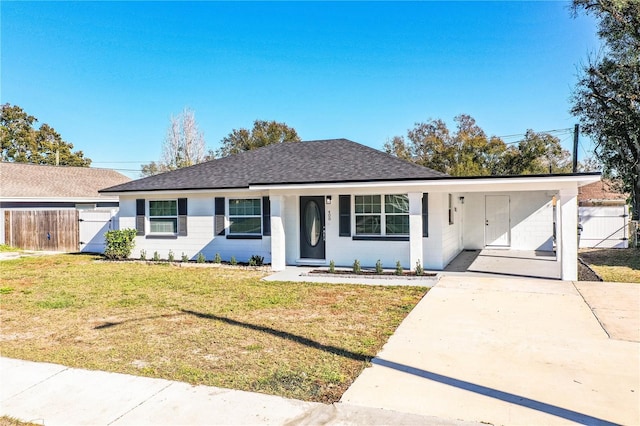 single story home with a carport and a front yard