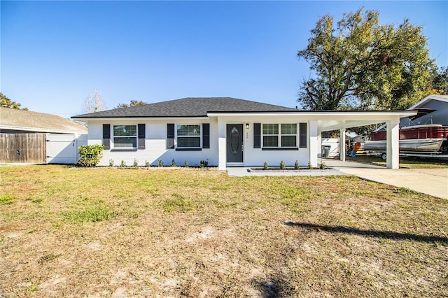 single story home featuring a front lawn and a carport