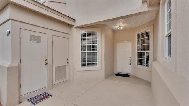 doorway to property featuring a patio area