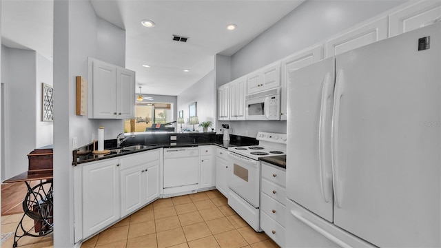 kitchen featuring white cabinetry, white appliances, and sink