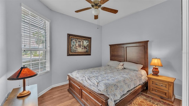 bedroom featuring ceiling fan and light hardwood / wood-style flooring