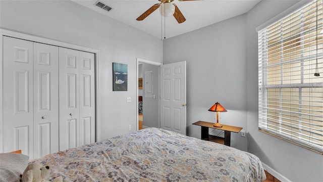 bedroom featuring ceiling fan and a closet