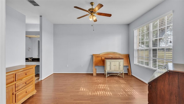 sitting room featuring ceiling fan and light hardwood / wood-style flooring