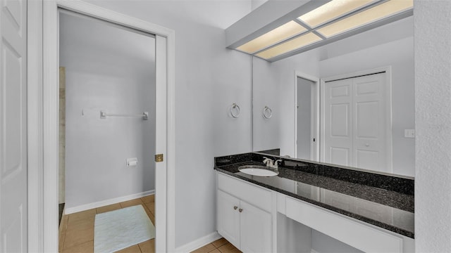 bathroom with tile patterned floors and vanity