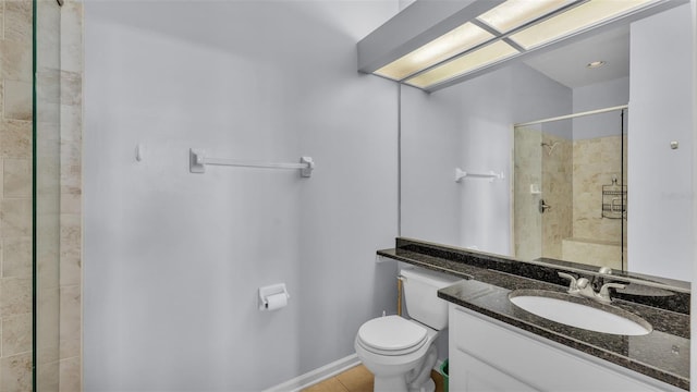 bathroom featuring an enclosed shower, vanity, tile patterned floors, and toilet