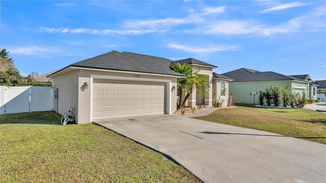 view of front of property with a garage and a front yard