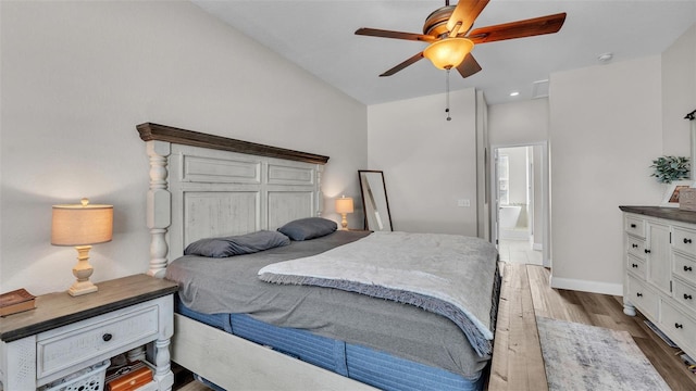 bedroom featuring ceiling fan, wood-type flooring, and ensuite bath