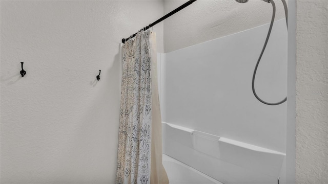 bathroom featuring a shower with curtain