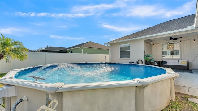 view of pool with ceiling fan