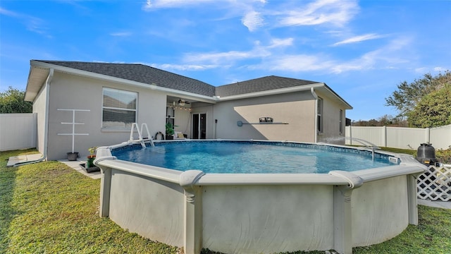 view of pool featuring a yard