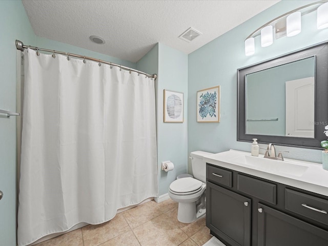 bathroom with walk in shower, toilet, a textured ceiling, vanity, and tile patterned flooring