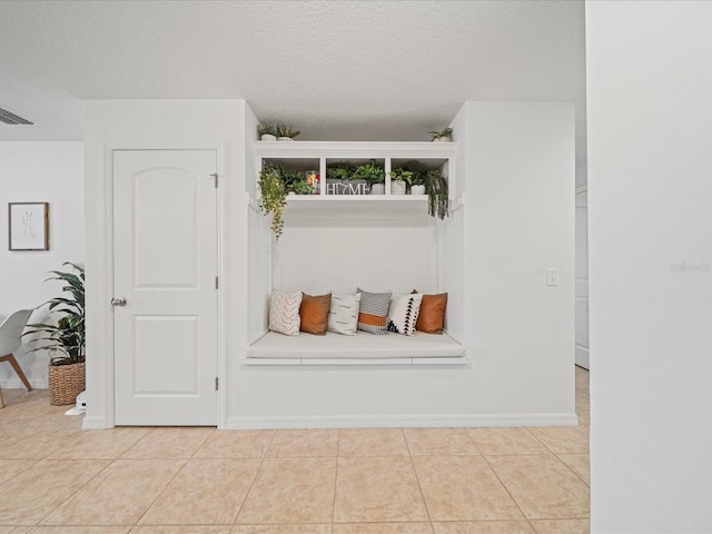 interior space featuring a textured ceiling