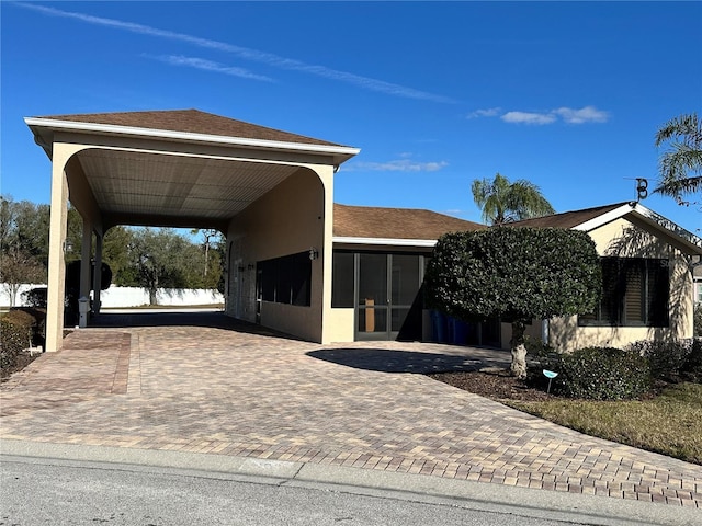 view of front facade with a carport