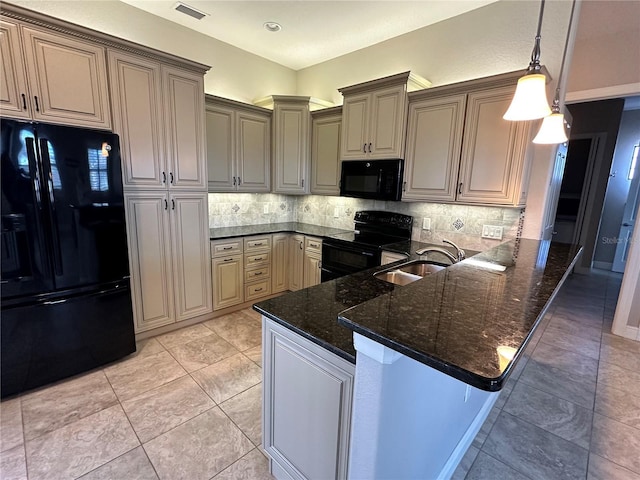 kitchen with tasteful backsplash, black appliances, sink, dark stone counters, and kitchen peninsula