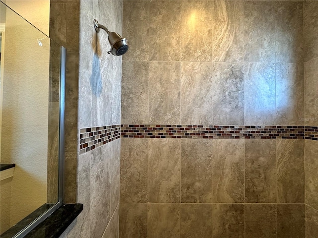 interior space featuring tiled shower