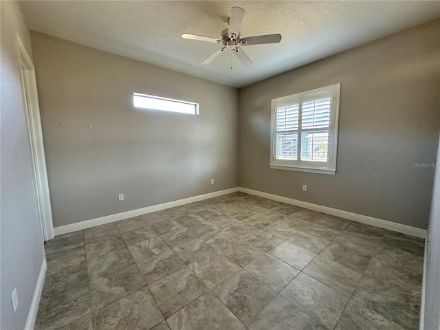 empty room featuring ceiling fan