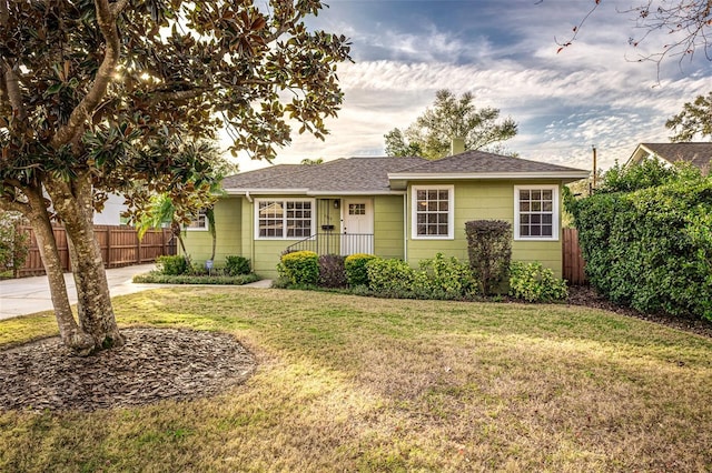 ranch-style house with a front yard