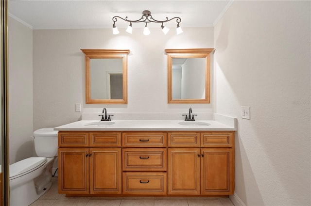 bathroom featuring crown molding, vanity, and toilet