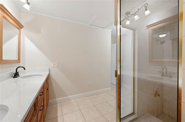 bathroom featuring vanity, ornamental molding, tile patterned floors, and a shower with shower door